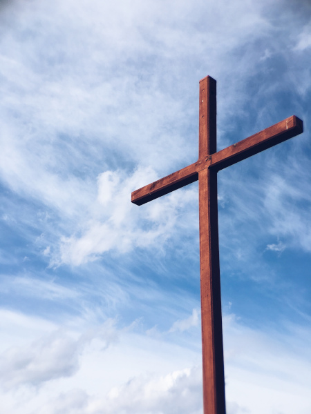 A wooden cross against the sky